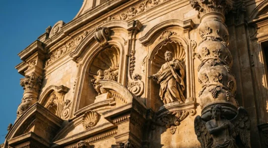 Authentic baroque church facade with dramatic sculptural elements, curved architecture, and ornate stone carvings illustrating Counter-Reformation grandeur