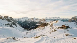 Winter mountain landscape with visitors enjoying non-skiing activities in snowy alpine destination