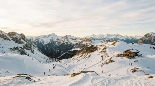 Winter mountain landscape with visitors enjoying non-skiing activities in snowy alpine destination